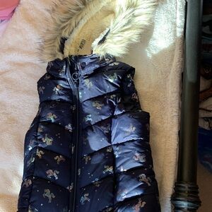 Blue H&M puffer vest size 6-8. Has a removable hood